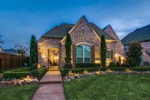House lighting in the dark with landscaping