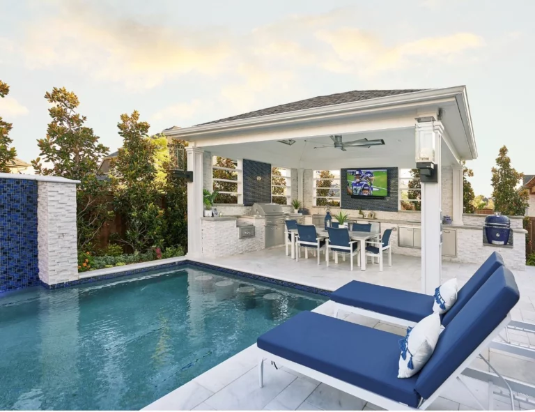 pergola covering an outdoor kitchen next to a pool in Dallas