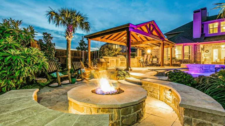 hardscaped fire pit area and outdoor kitchen