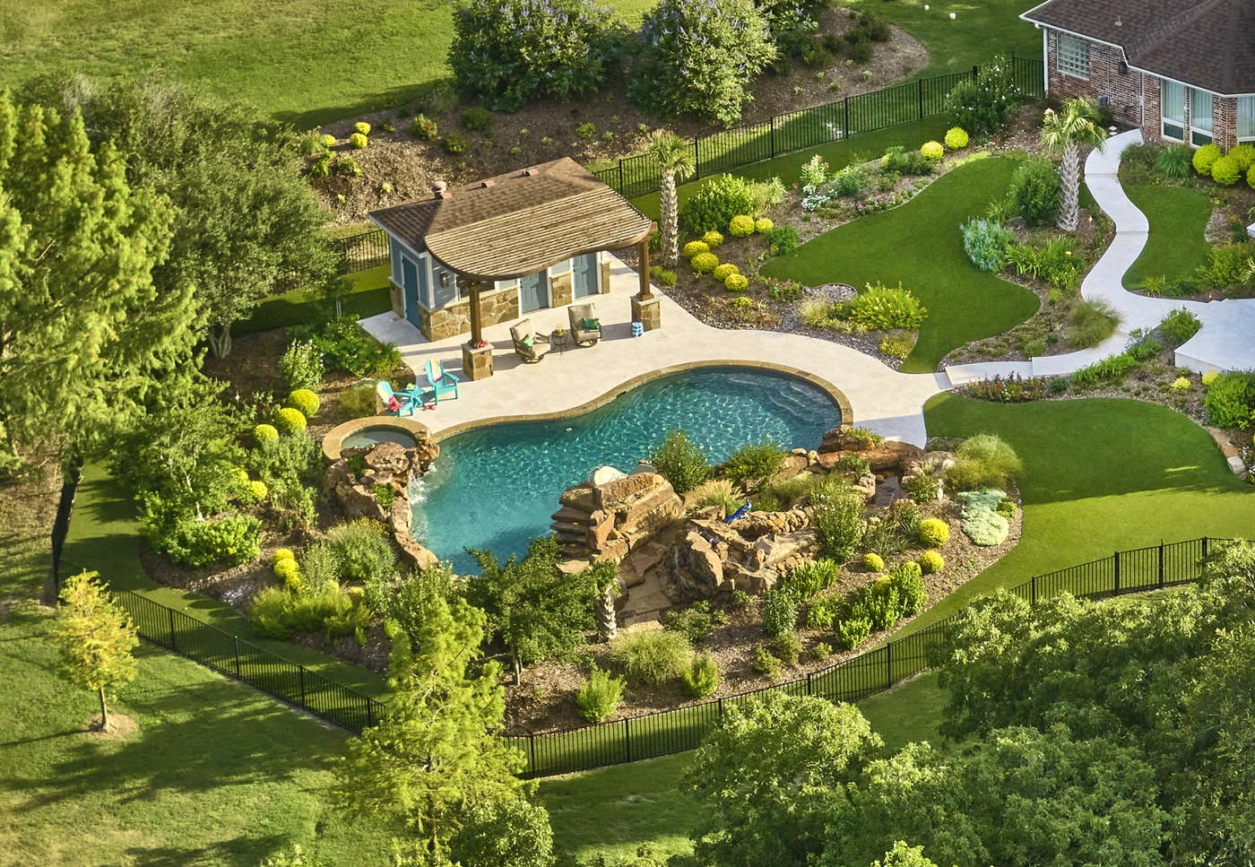 aerial view of pool and pool house