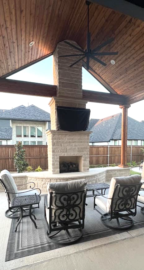 stone and wood pavilion with seating area