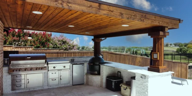 outdoor kitchen under wooden pergola