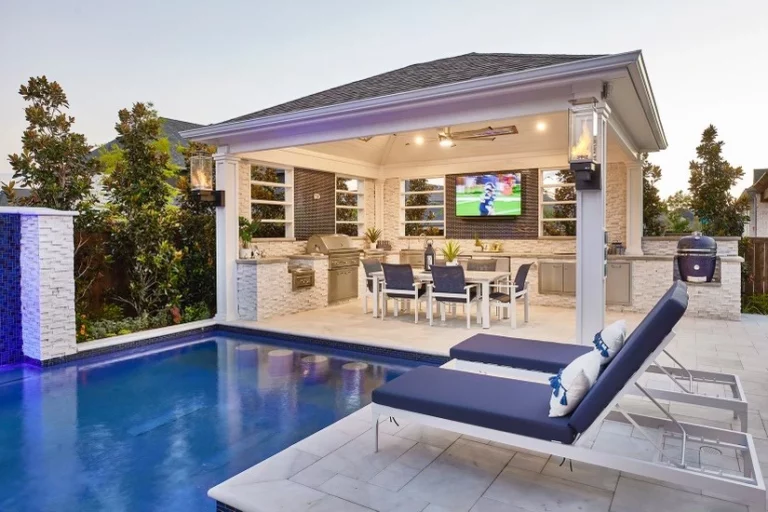 white pergola with outdoor kitchen