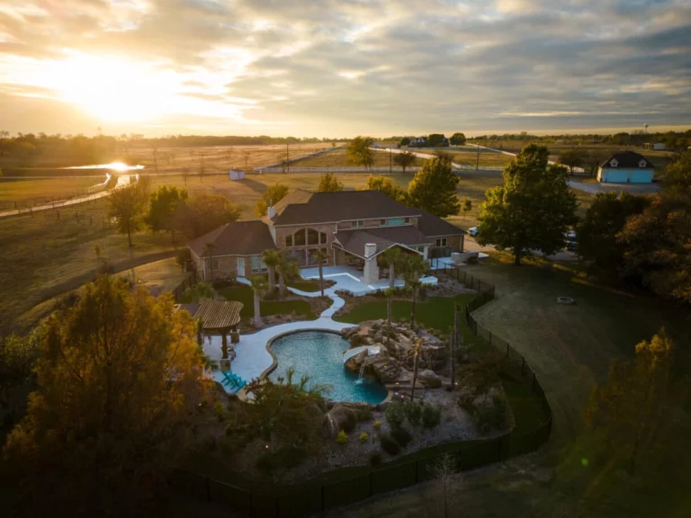 aerial pool and patio at sunset